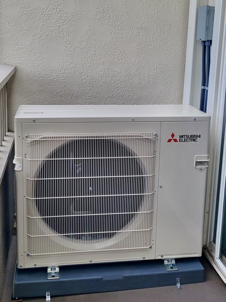 A Mitsubishi multi-zone heat pump is a ductless mini-split air conditioning system that is designed to provide heating and cooling to multiple rooms or zones using a single outdoor unit and multiple indoor units. This system is ideal for homes or buildings with multiple rooms or areas that require individual temperature control. It is easy to install and operates quietly. With its ability to provide individual temperature control in multiple rooms or zones, the Mitsubishi multi-zone heat pump can help improve comfort levels while reducing energy waste.