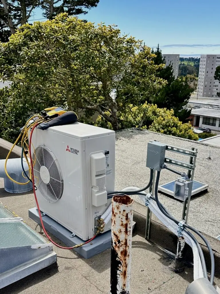 Mitsubishi SUZ-KA30N heat pump installed on the roof by Nur HVAC