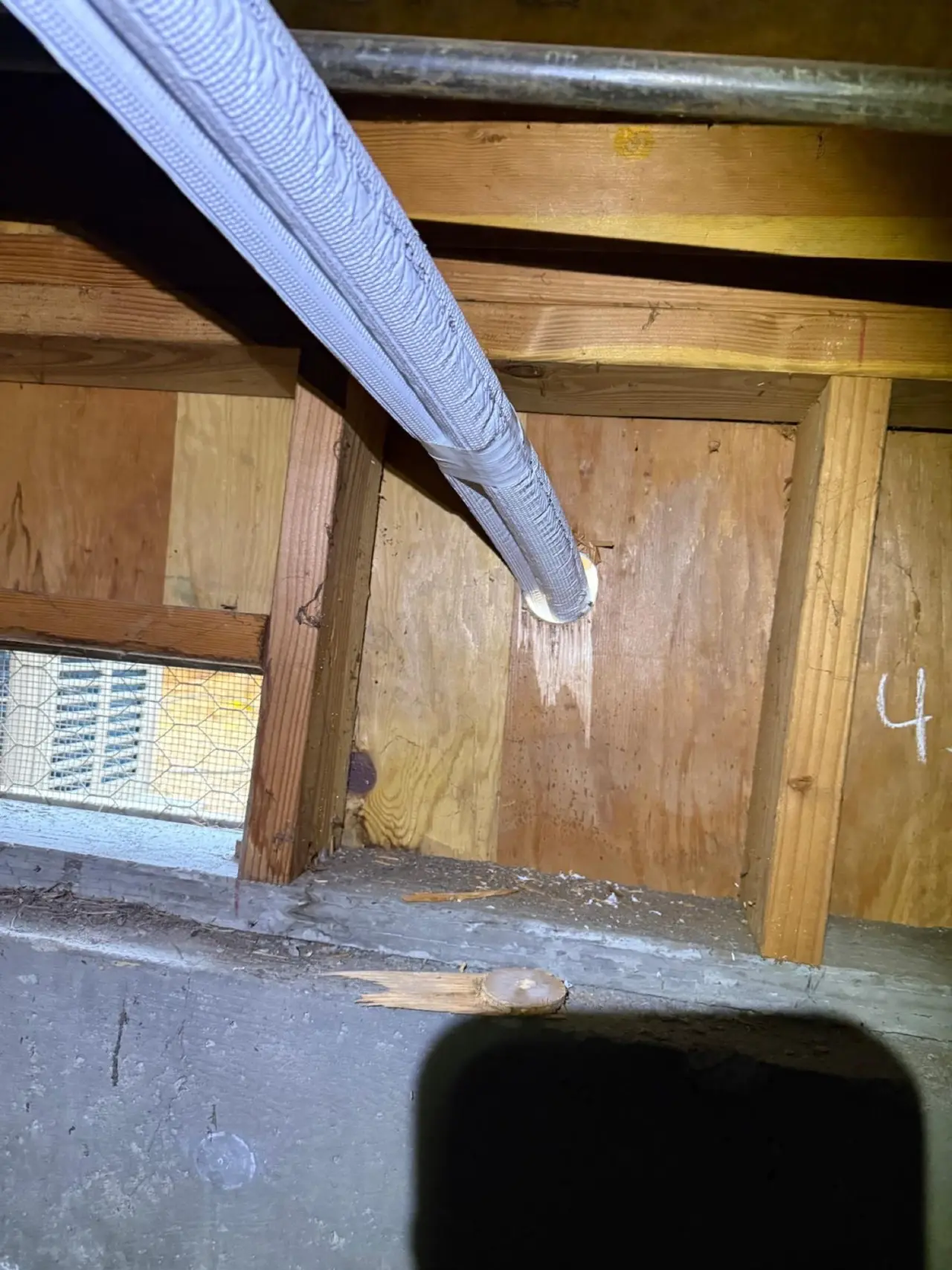 Insulated refrigerant line set routed through the framing under a Palo Alto home