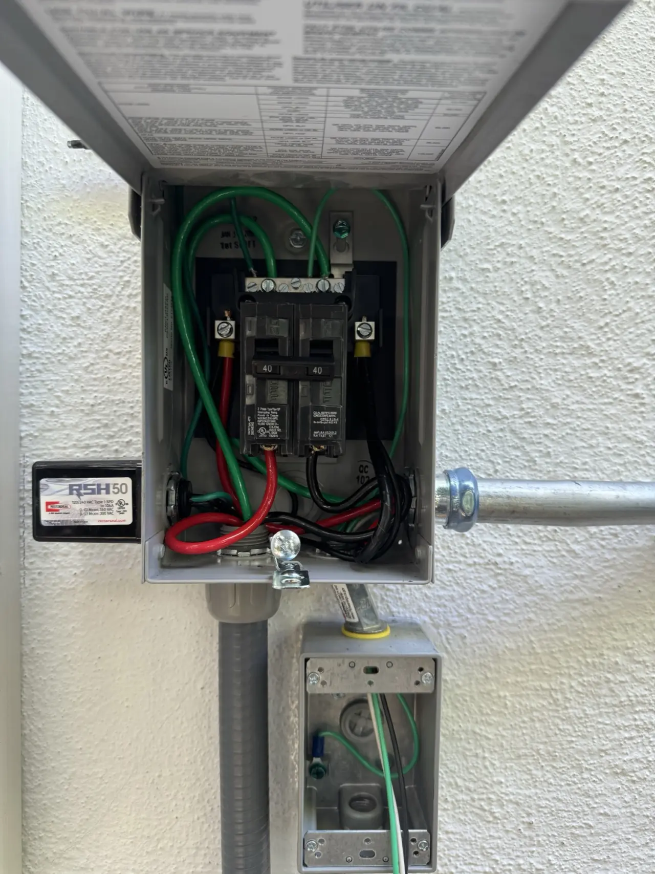 Outdoor electrical disconnect with surge protection wired for a Mitsubishi heat pump in Redwood City