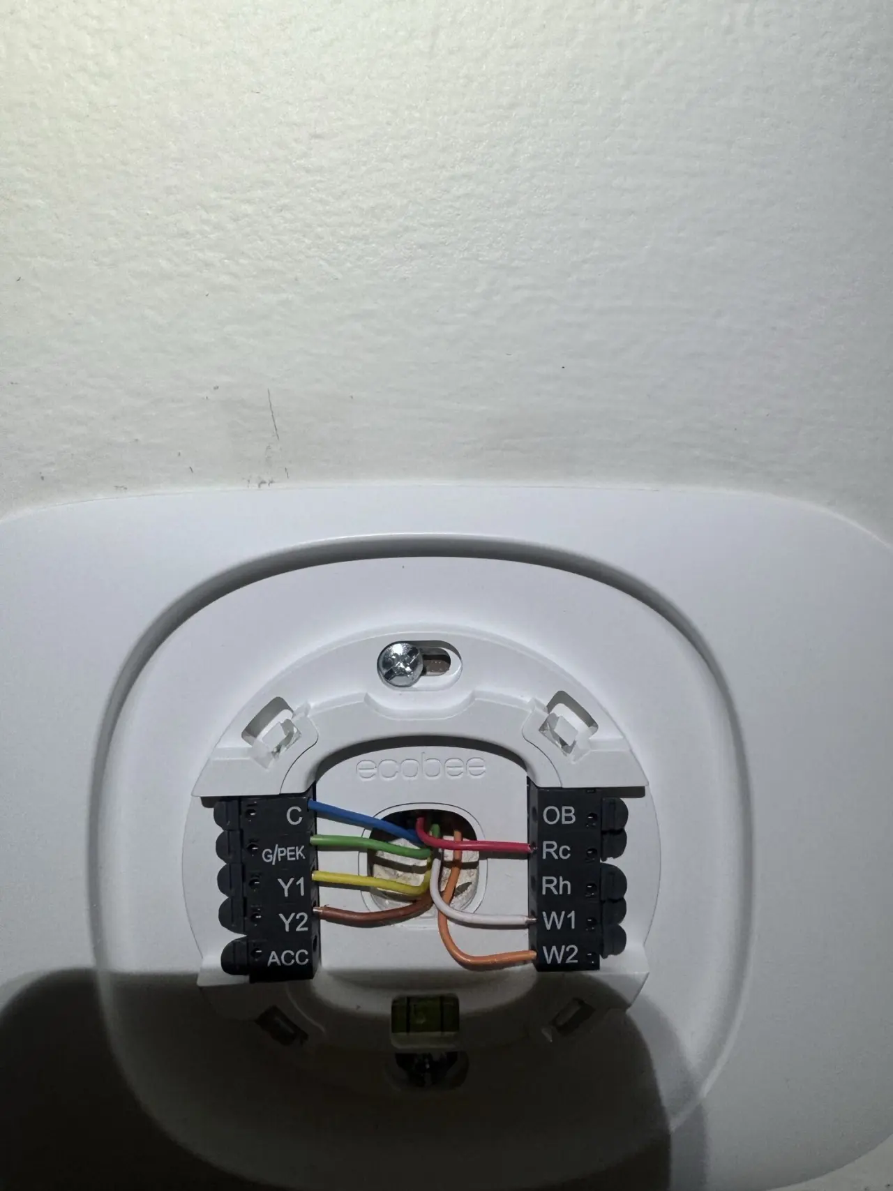 Smart thermostat base wired during a Mitsubishi heat pump installation in Redwood City