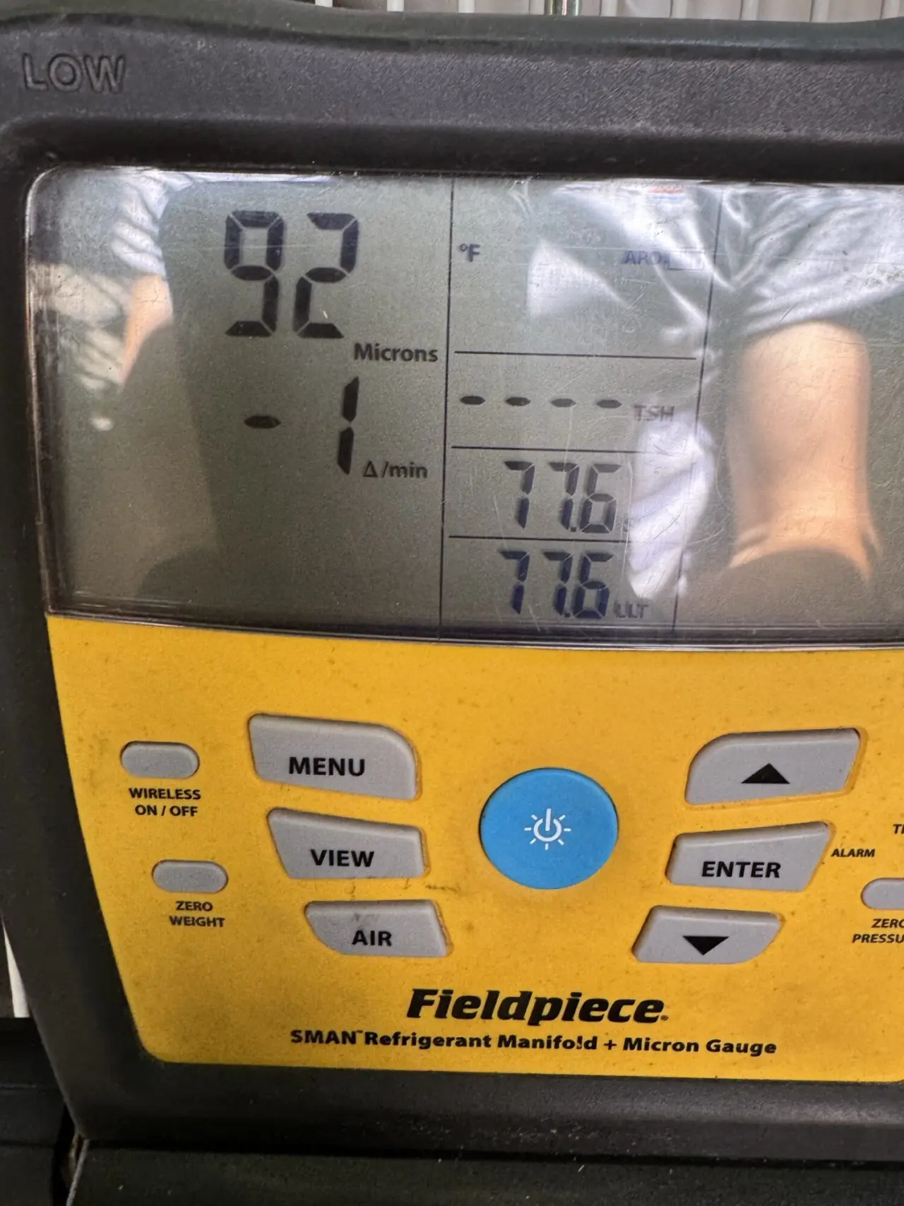 Micron gauge confirming a deep vacuum during a Redwood City heat pump installation