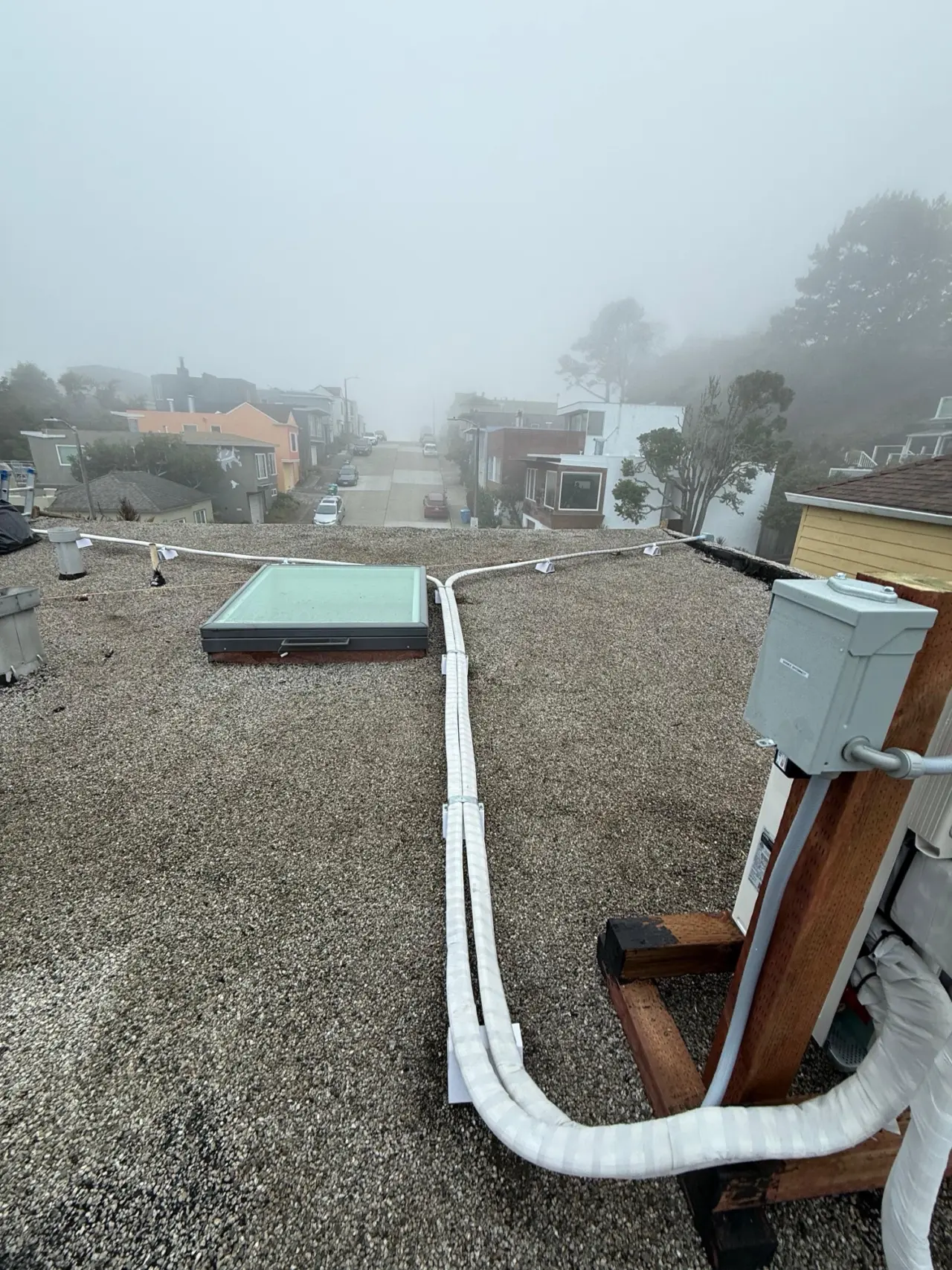 Mini-split refrigerant line sets and outdoor disconnect on a San Francisco roof