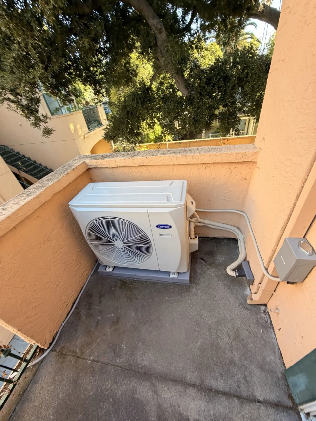 Carrier heat pump condenser and outdoor electrical disconnect installed in Mountain View