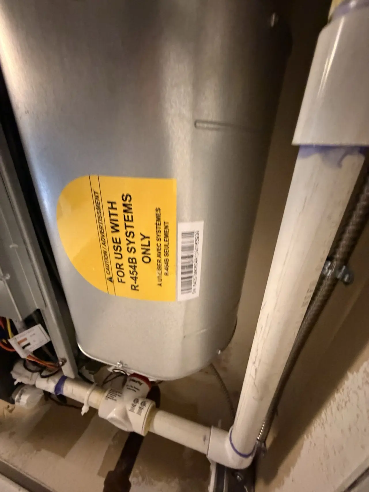New Carrier air handler with R-454B refrigerant label during a Mountain View heat pump installation