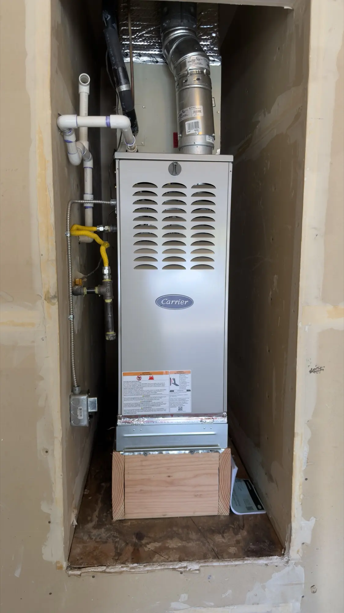 Front view of a newly installed Carrier furnace in a San Jose home
