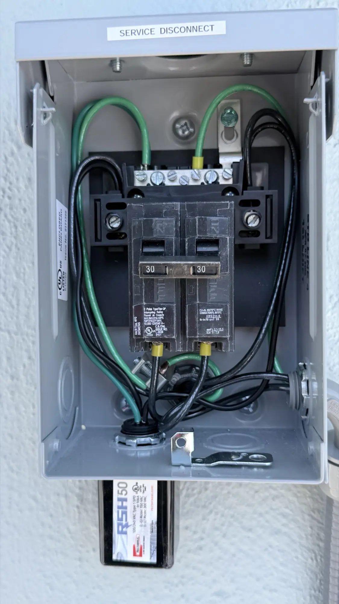 New electrical service disconnect for a Carrier heat pump in San Carlos