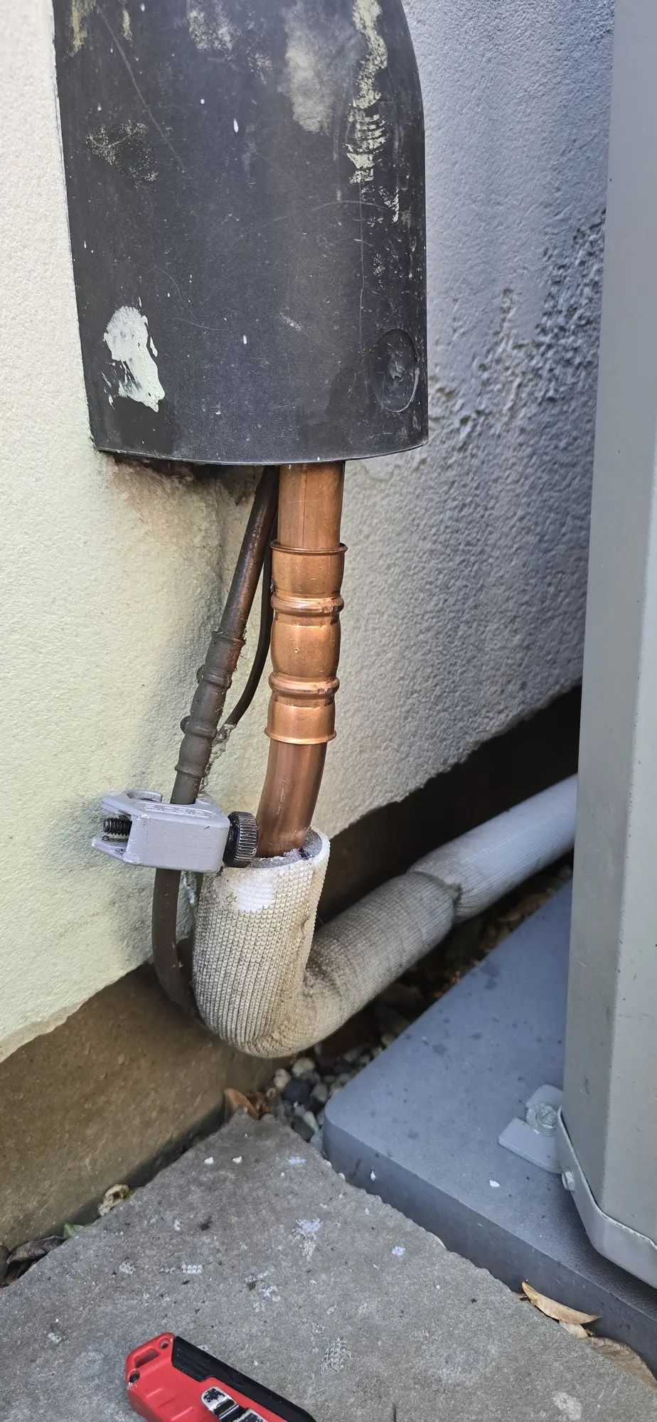 Repaired copper liquid line with a new brazed coupling on an HVAC system in Burlingame