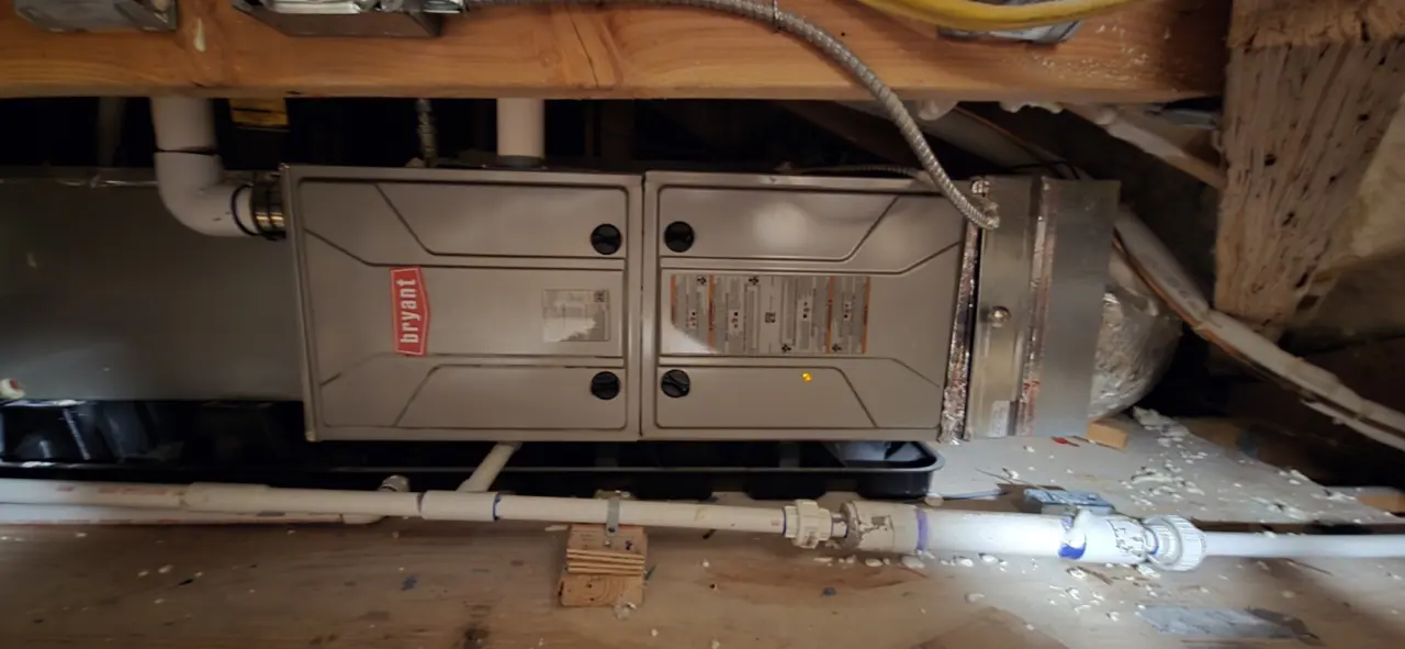 Bryant indoor air handler connected to the ductwork of an HVAC system in Burlingame