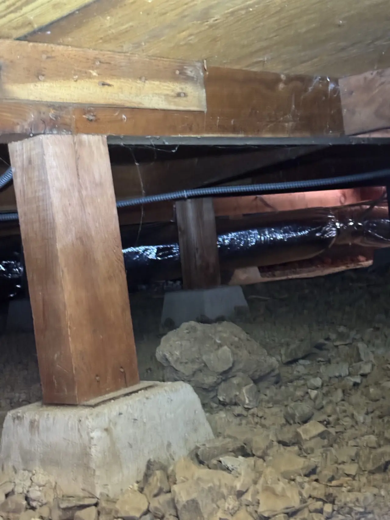 Insulated refrigerant lineset for a Mitsubishi heat pump routed through a Belmont crawlspace