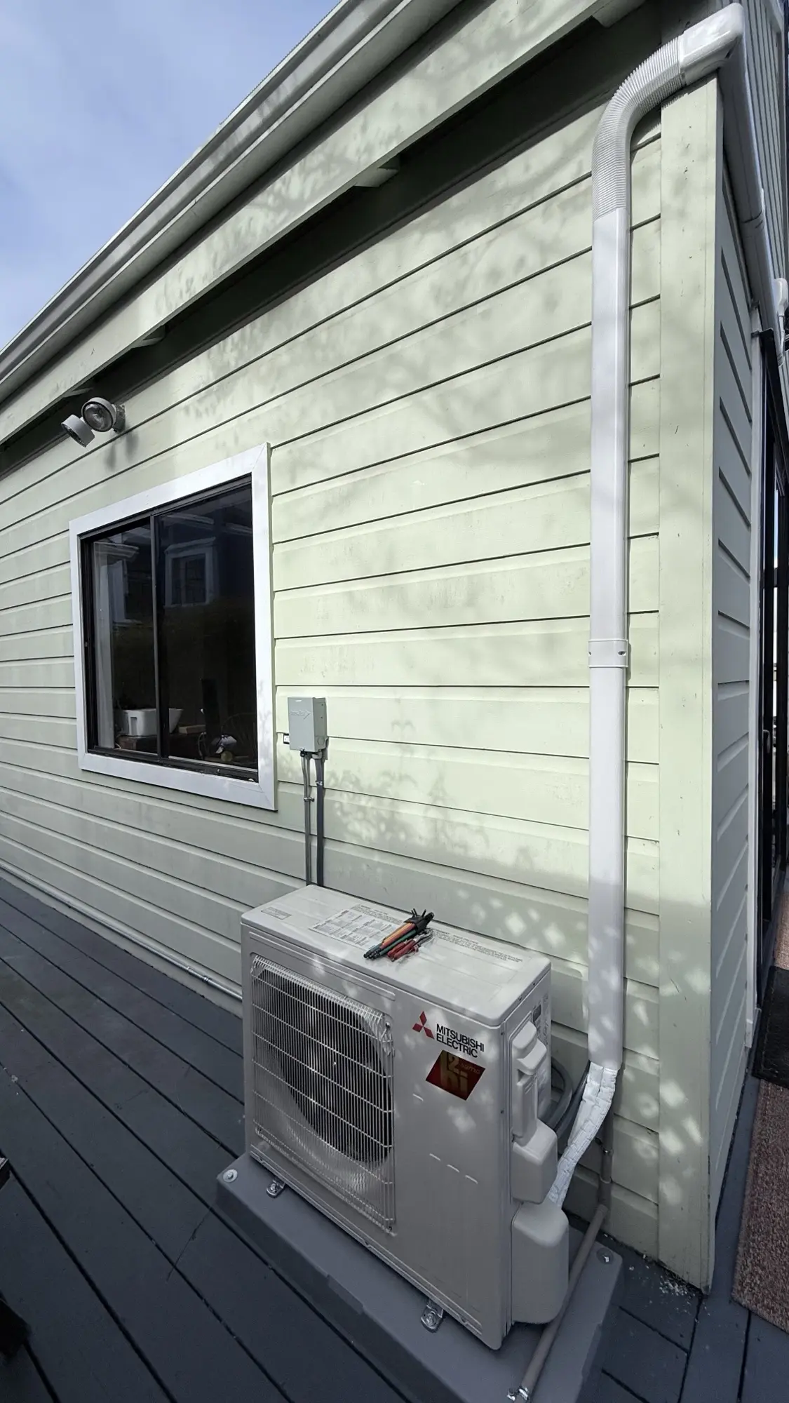 Mitsubishi Electric ductless mini-split condenser installed on a deck at a San Francisco home