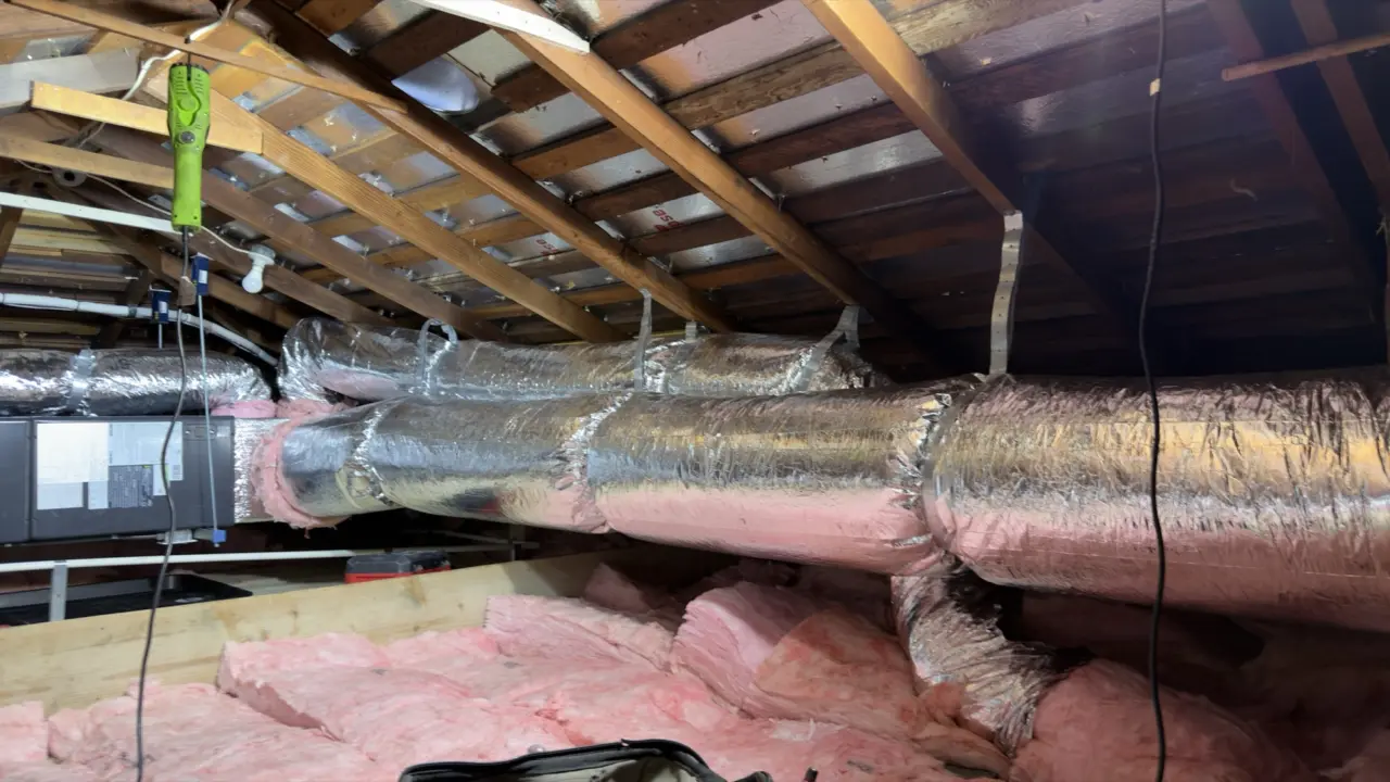 New insulated flex ductwork running through a Palo Alto attic for a Carrier heat pump