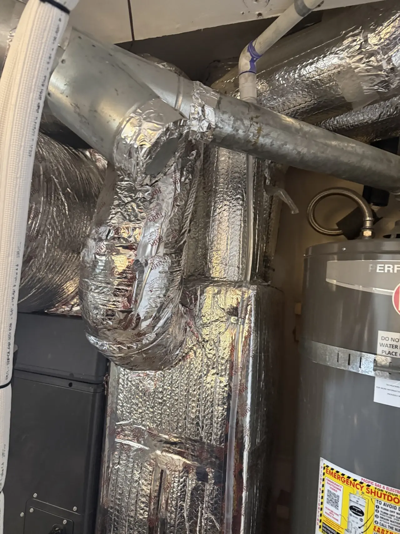 New supply plenum and duct connections on a Carrier heat pump system in San Francisco