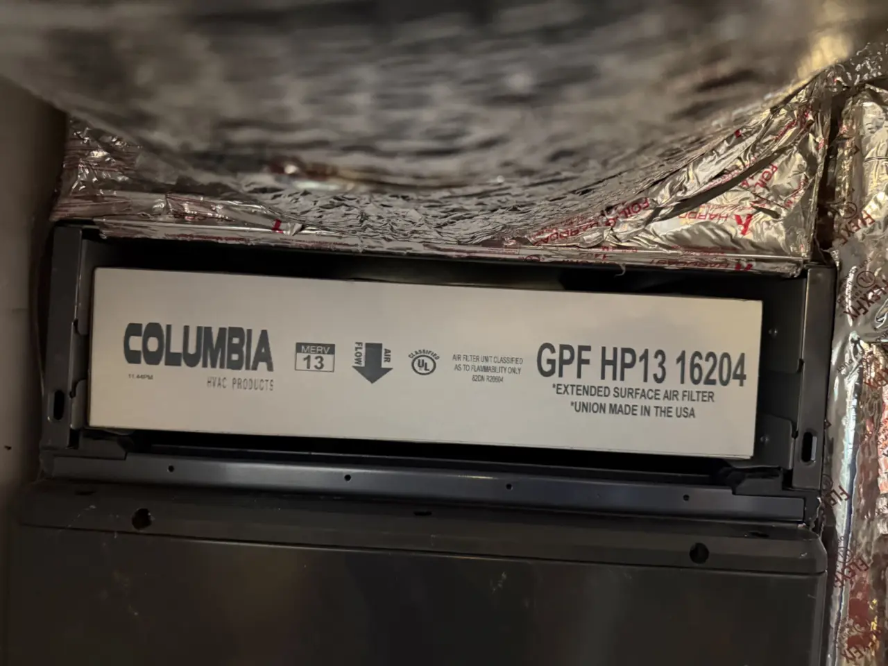 MERV 13 air filter installed on a Carrier heat pump system in San Francisco