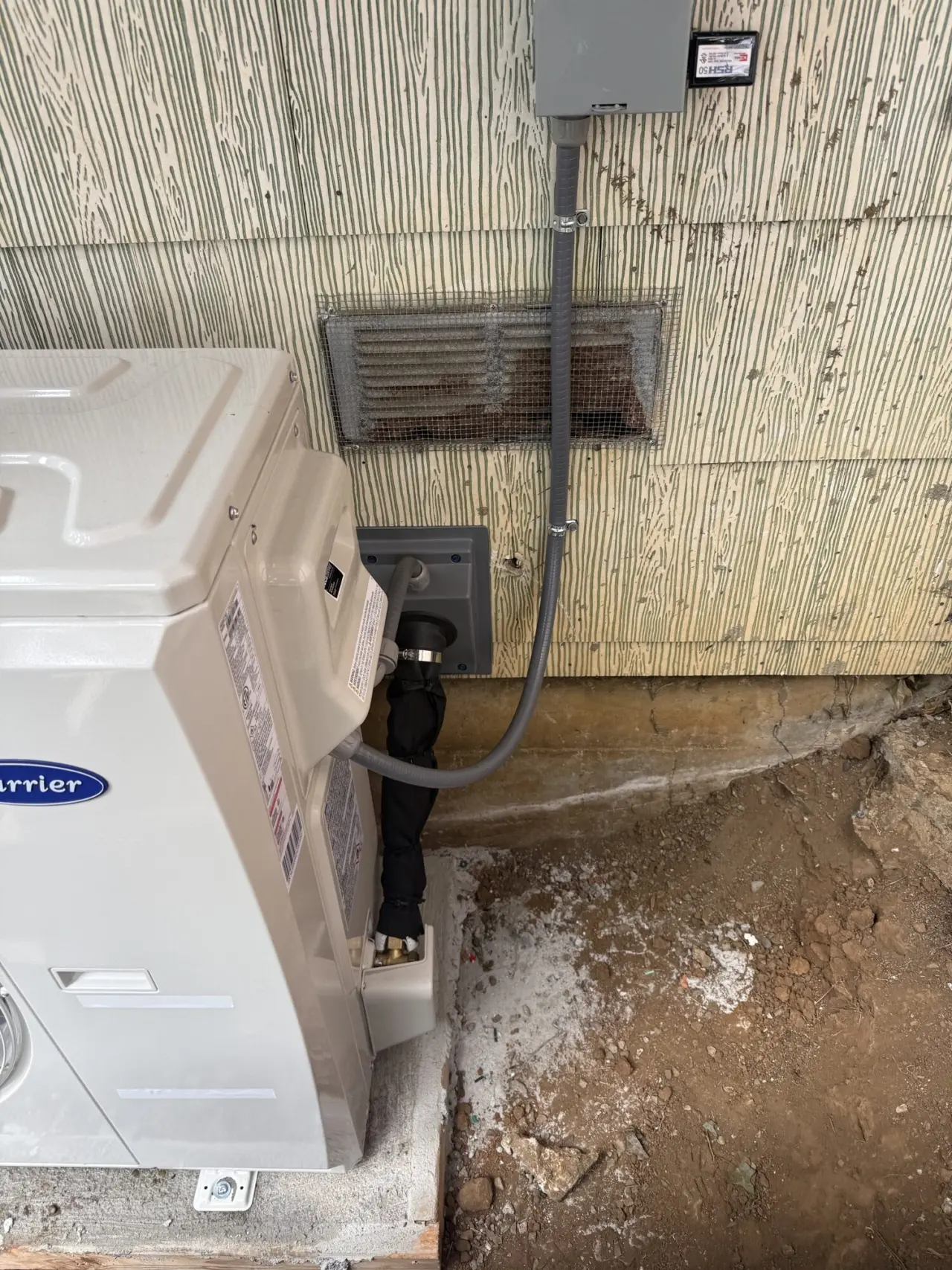 Refrigerant lineset and electrical disconnect at a Carrier heat pump in San Francisco