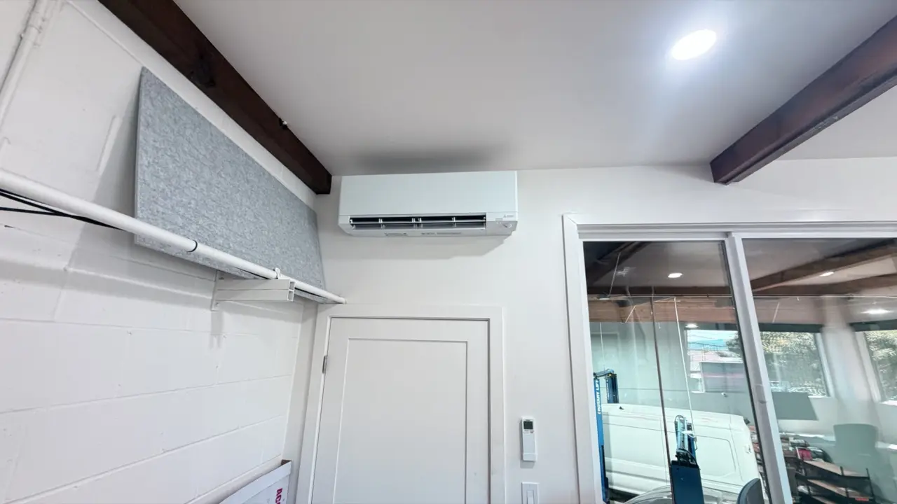 Mitsubishi wall-mounted ductless mini-split indoor head installed in a Redwood City room