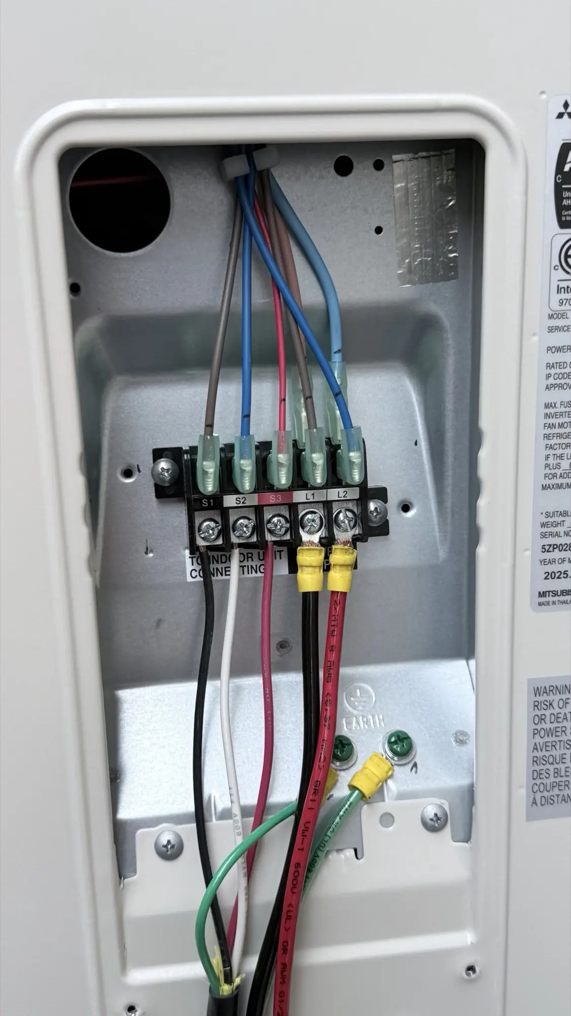 Terminal block wiring connections on a Mitsubishi heat pump in San Bruno