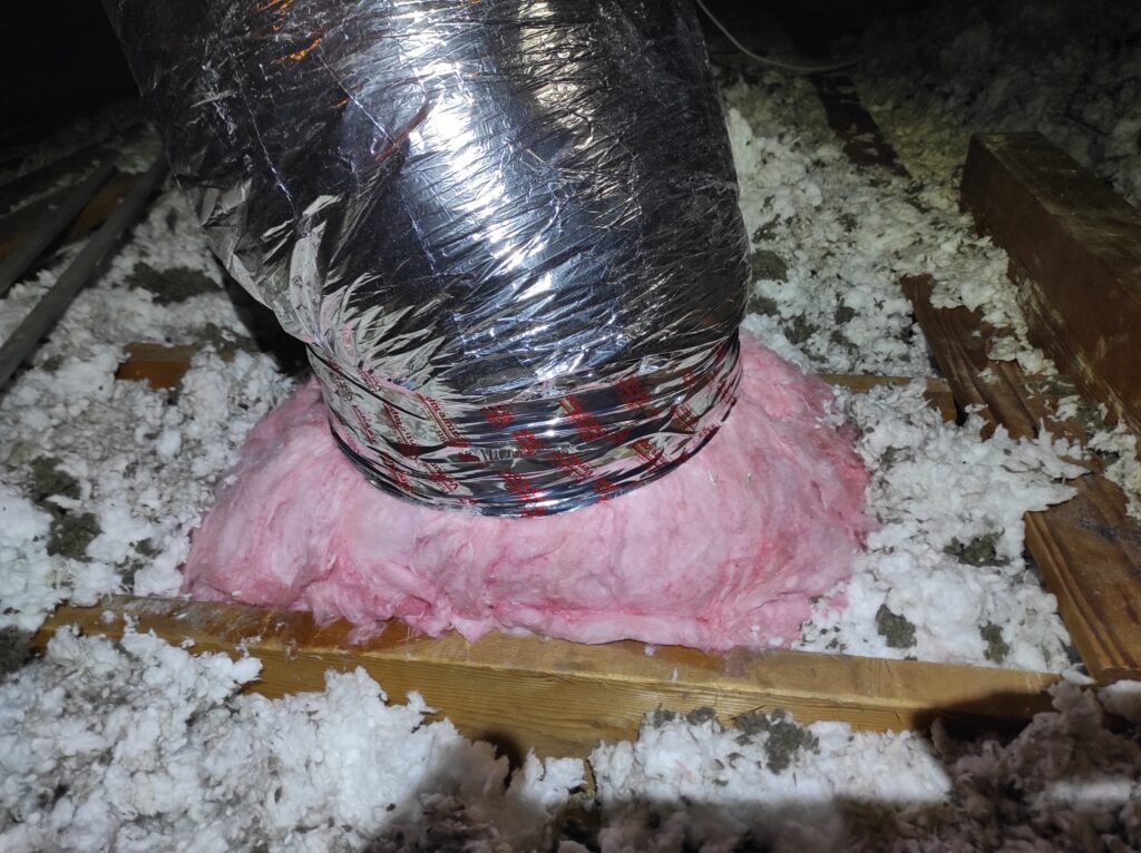 Insulated flexible duct run in attic after heat pump installation in Cupertino