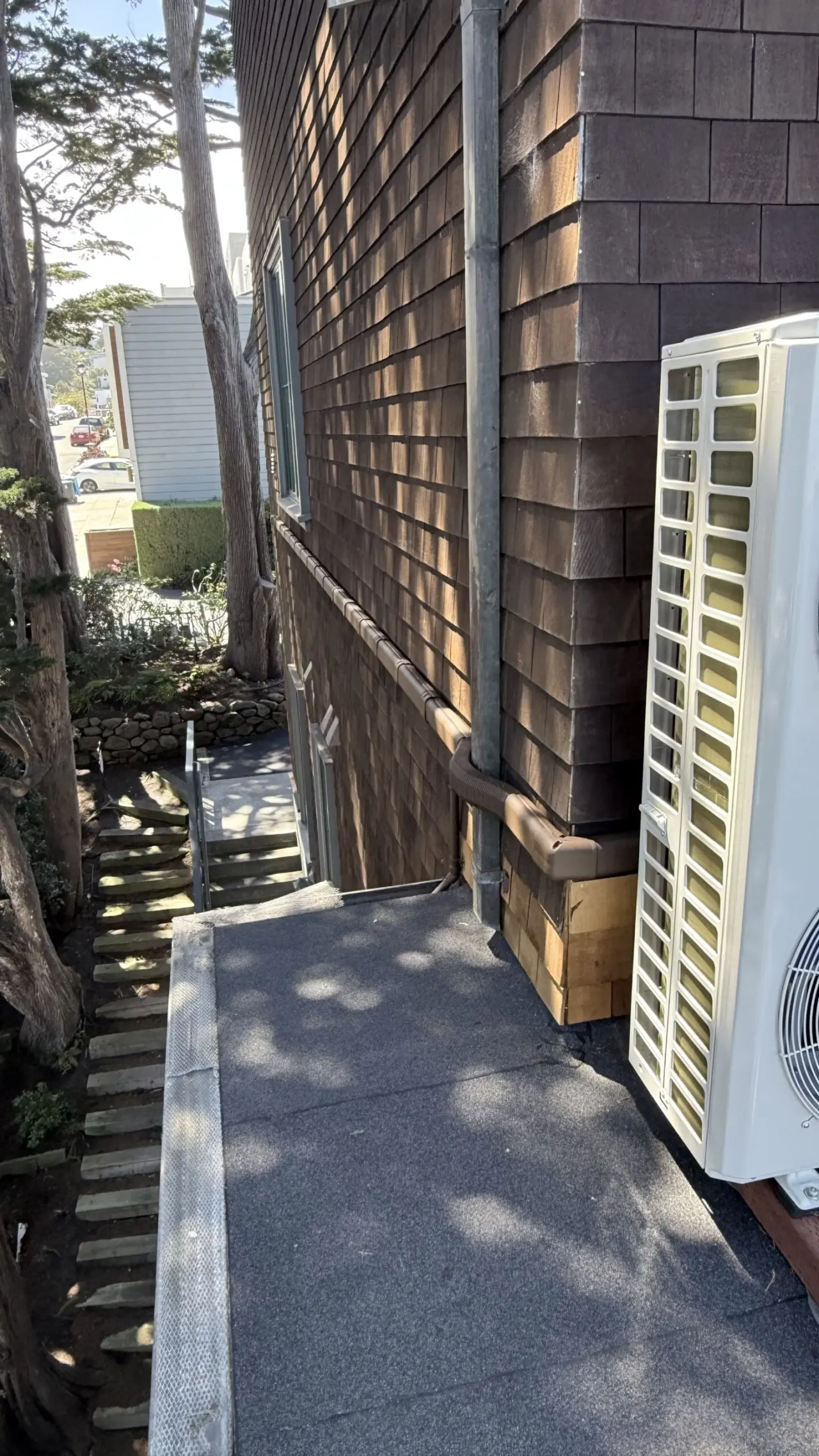 Carrier heat pump condenser mounted on rooftop deck of a San Francisco home