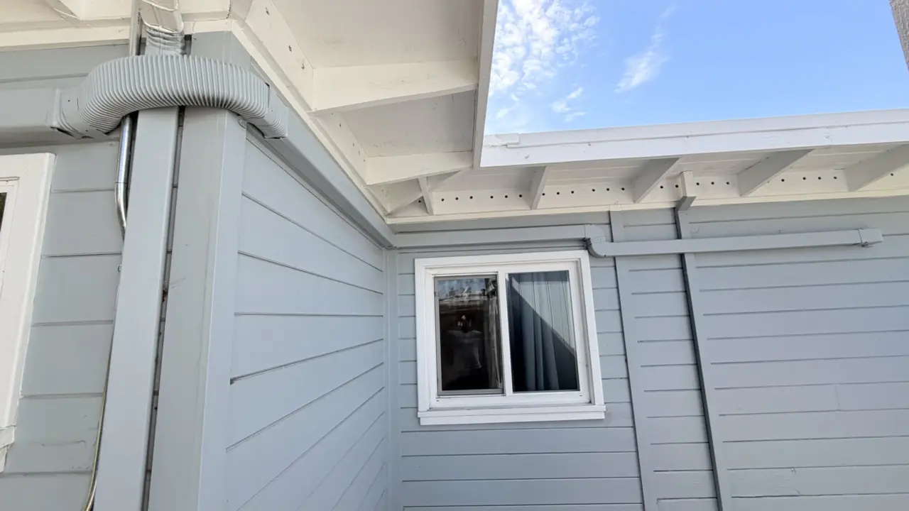 Insulated line set routed along exterior wall for heat pump system in San Mateo