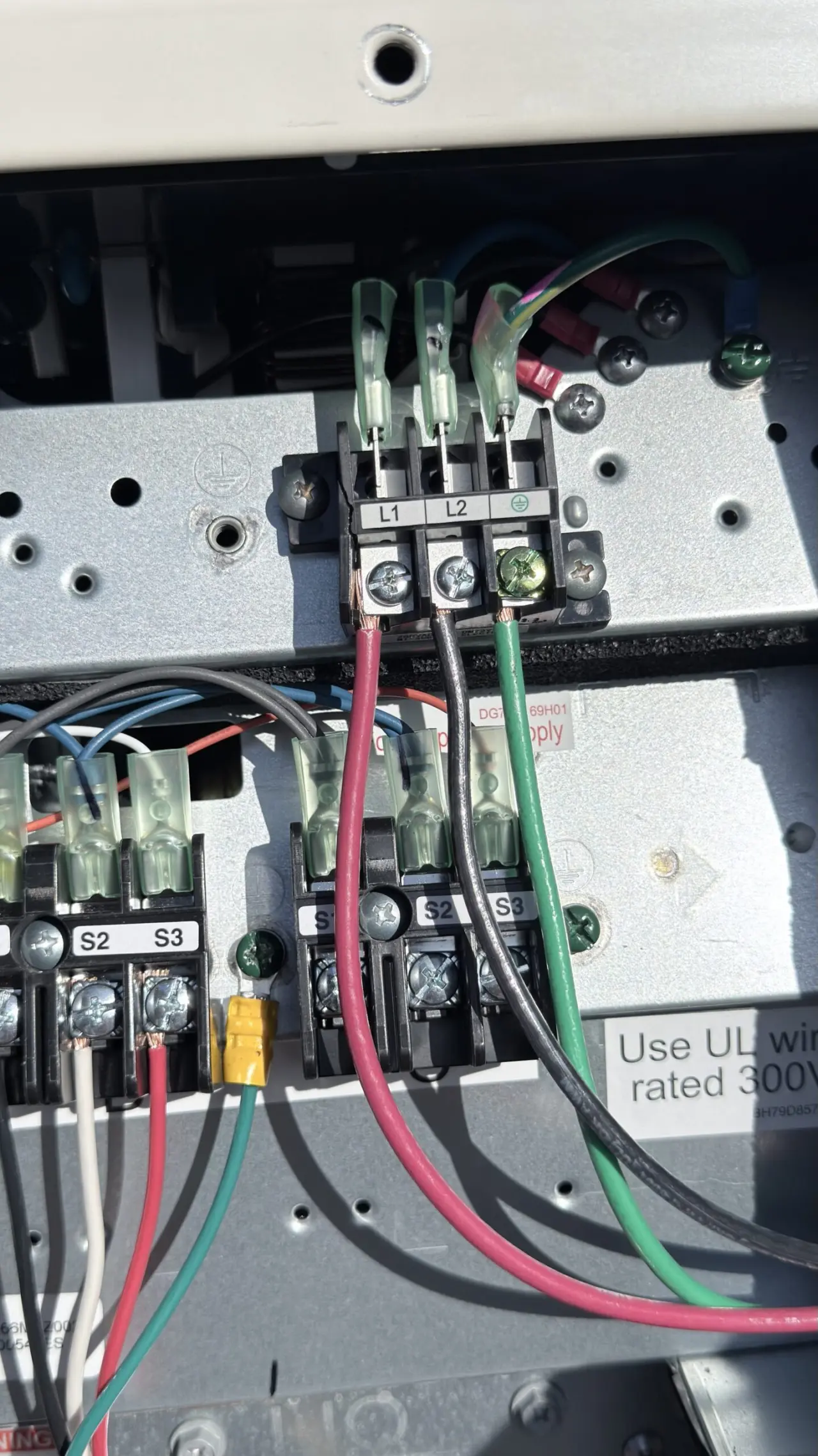 Tidy electrical terminal connections for a Mitsubishi mini-split condenser in San Francisco