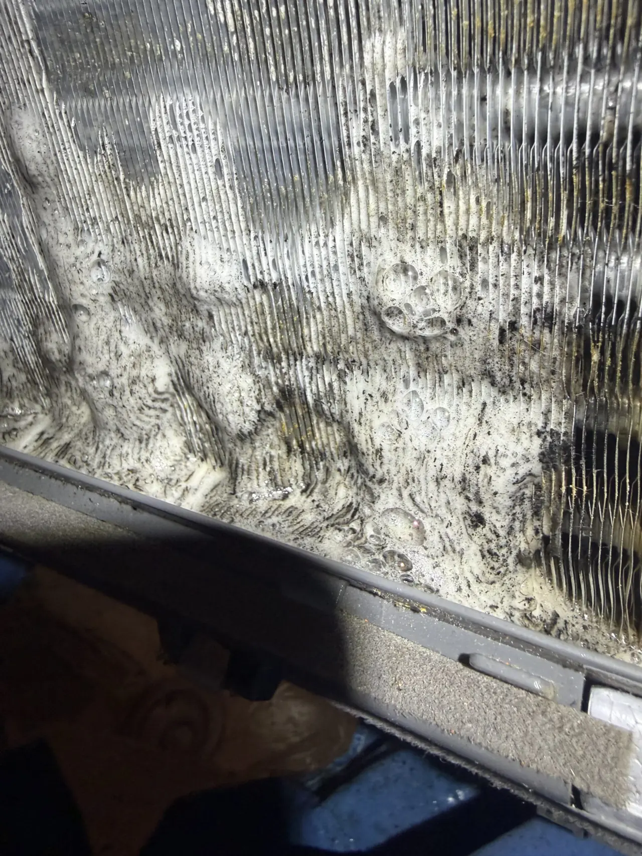 Heavy dirt buildup on the evaporator coil of a Mitsubishi mini split in Mountain View before cleaning