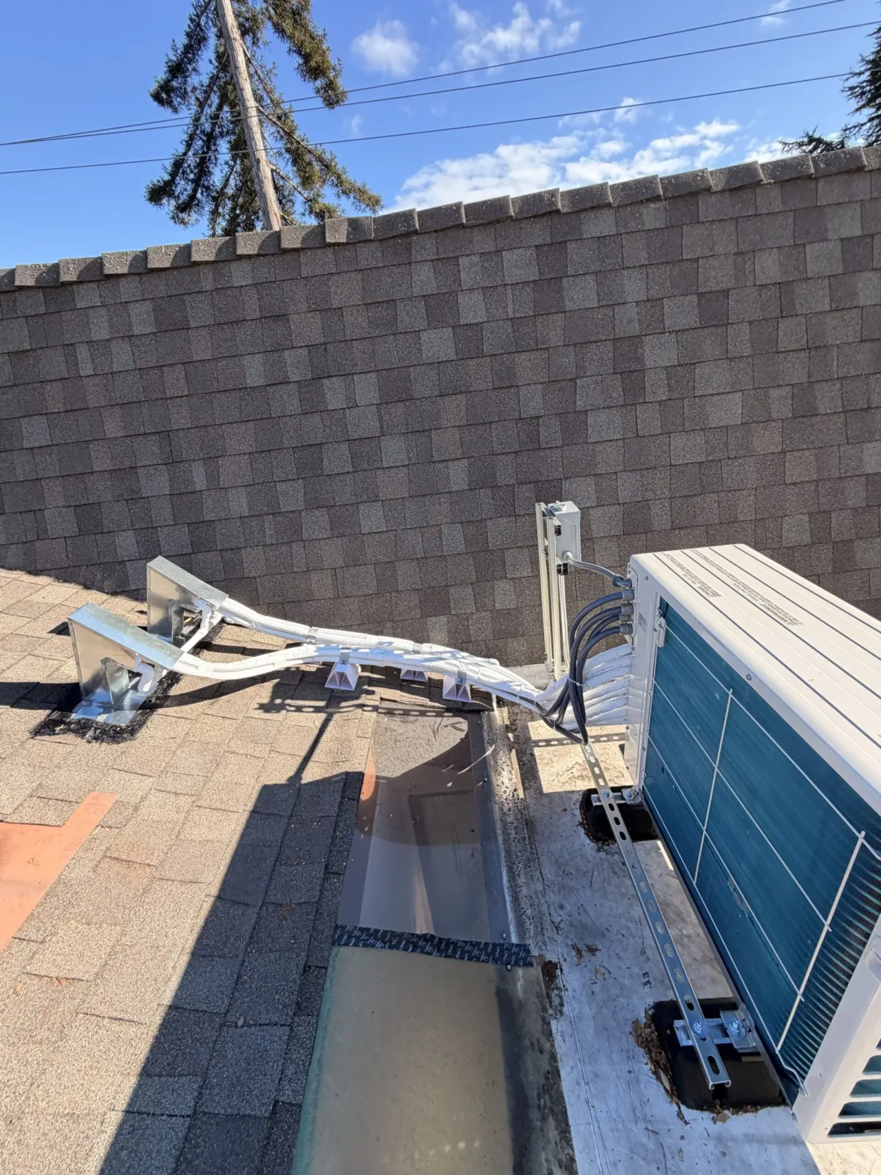Finished Mitsubishi 4-zone heat pump outdoor unit installed on rooftop in Cupertino