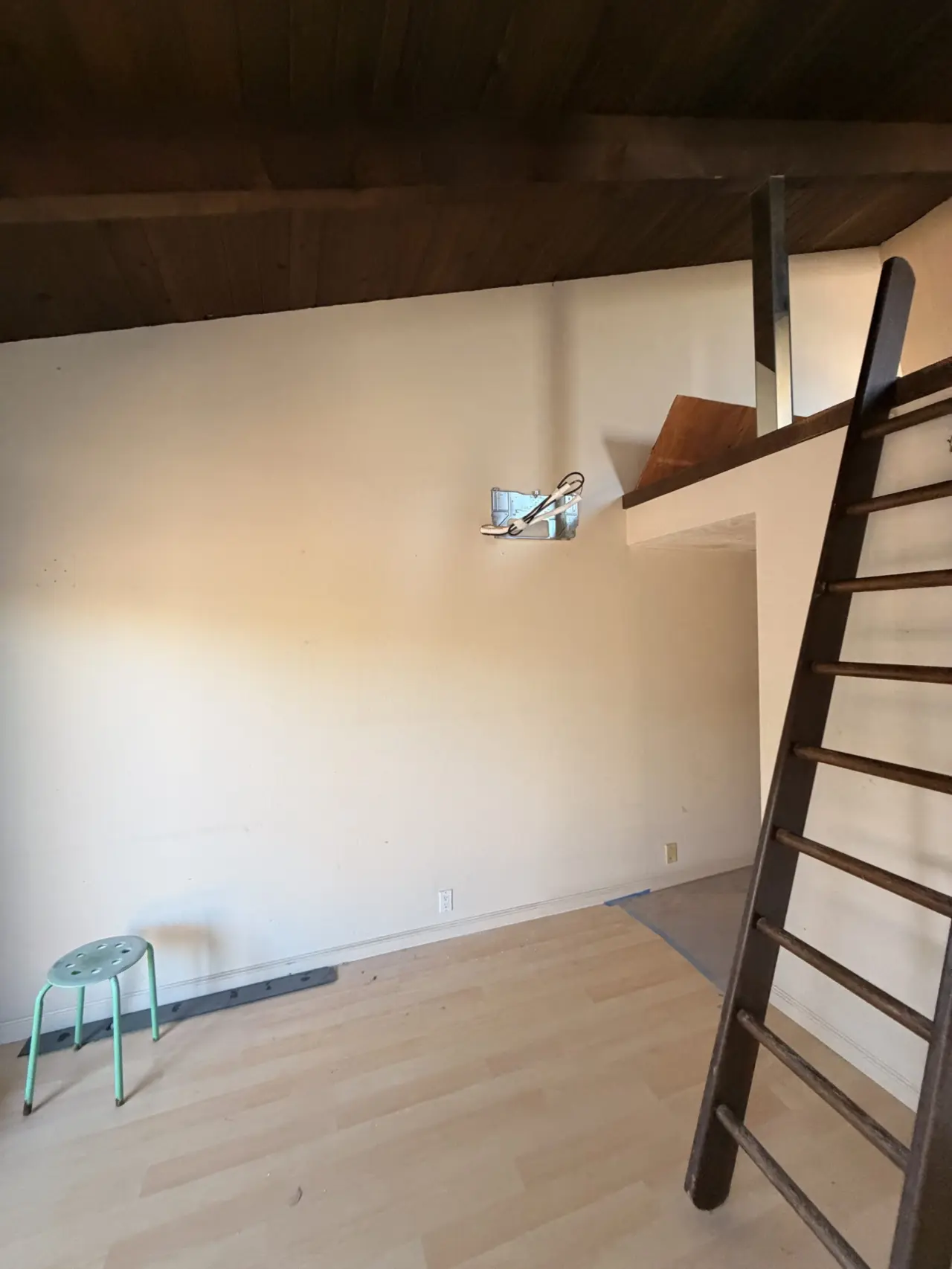 Wall bracket for indoor heat pump zone before unit mounting in Cupertino home