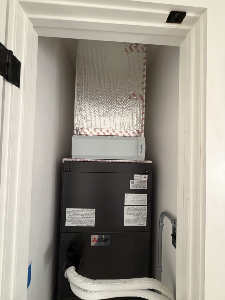 Mitsubishi SVZ-AP36NL air handler installed in closet during heat pump installation in Cupertino