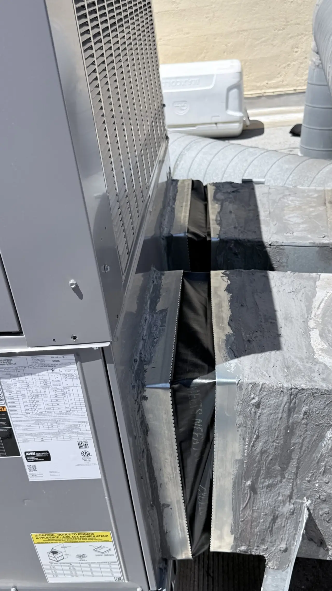 Sealed duct-to-curb connection on new Carrier rooftop unit in San Francisco
