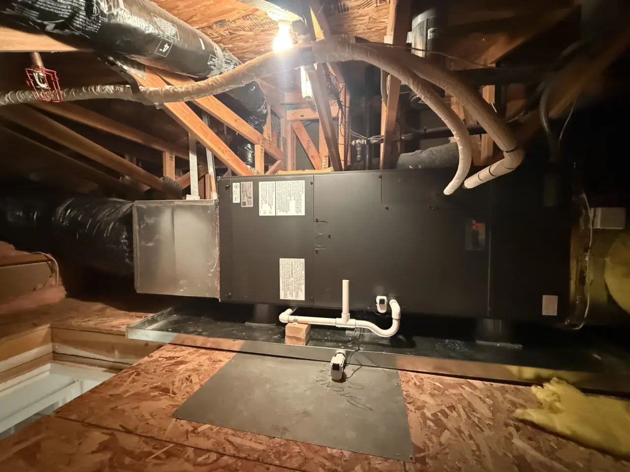 New Mitsubishi air handler in a South San Francisco attic with drain pan and PVC condensate line